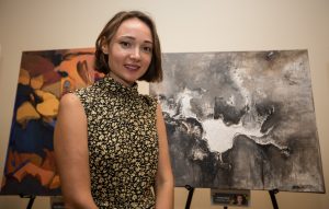 NEW YORK, NY - SEPTEMBER 21 : Ms Annya Sand with her painting at the Opening Exhibition at the United Nations. Art Camp ÒColors for the PlanetÓ at the United Nations on September 21, 2016 in New York, VIEWpress/Maite H. Mateo