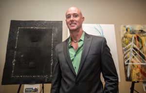 NEW YORK, NY - SEPTEMBER 21 : Michael Massaro with his painting at the Opening Exhibition at the United Nations. Art Camp ÒColors for the PlanetÓ at the United Nations on September 21, 2016 in New York, VIEWpress/Maite H. Mateo